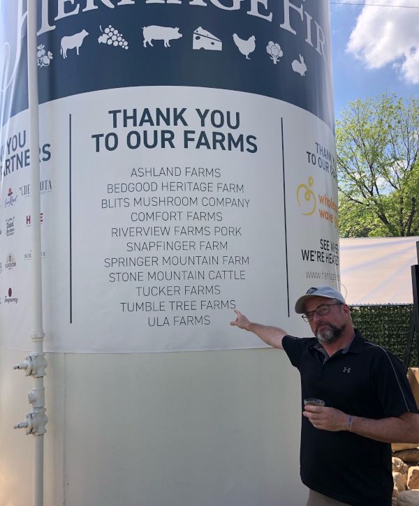 A sign thanking the farmers who provided the raw materials to a food festival